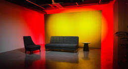Sydney TV Studio Hire with yellow and red atmospheric lighting.